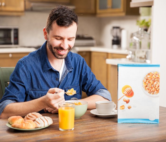 Guy eating cereal for breakfast